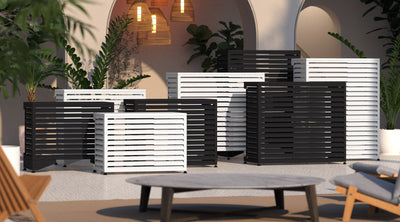 Hangar mini split covers in black and white on a courtyard patio at dusk